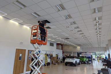 CEMA Lighting lighting installation team installing new high-efficiency LED Halo panels at Wilson and Co, Grimsby Car Showroom